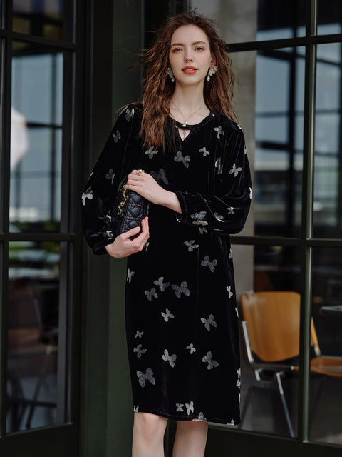 Women's black Silk Velvet burnout nightdress, standing pose with bag