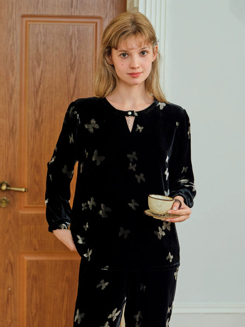 Close-up of the neckline keyhole with pearl button and butterfly burnout velvet
