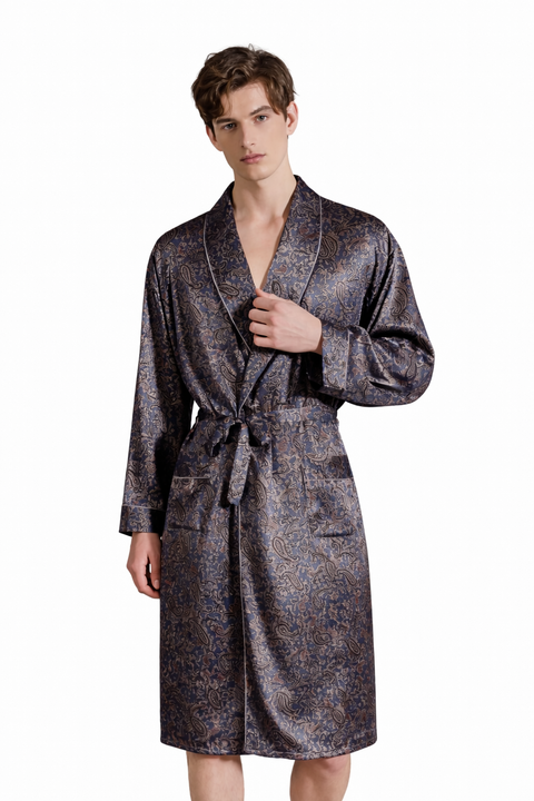 Man wearing a paisley silk rob, a patterned robe on a white background